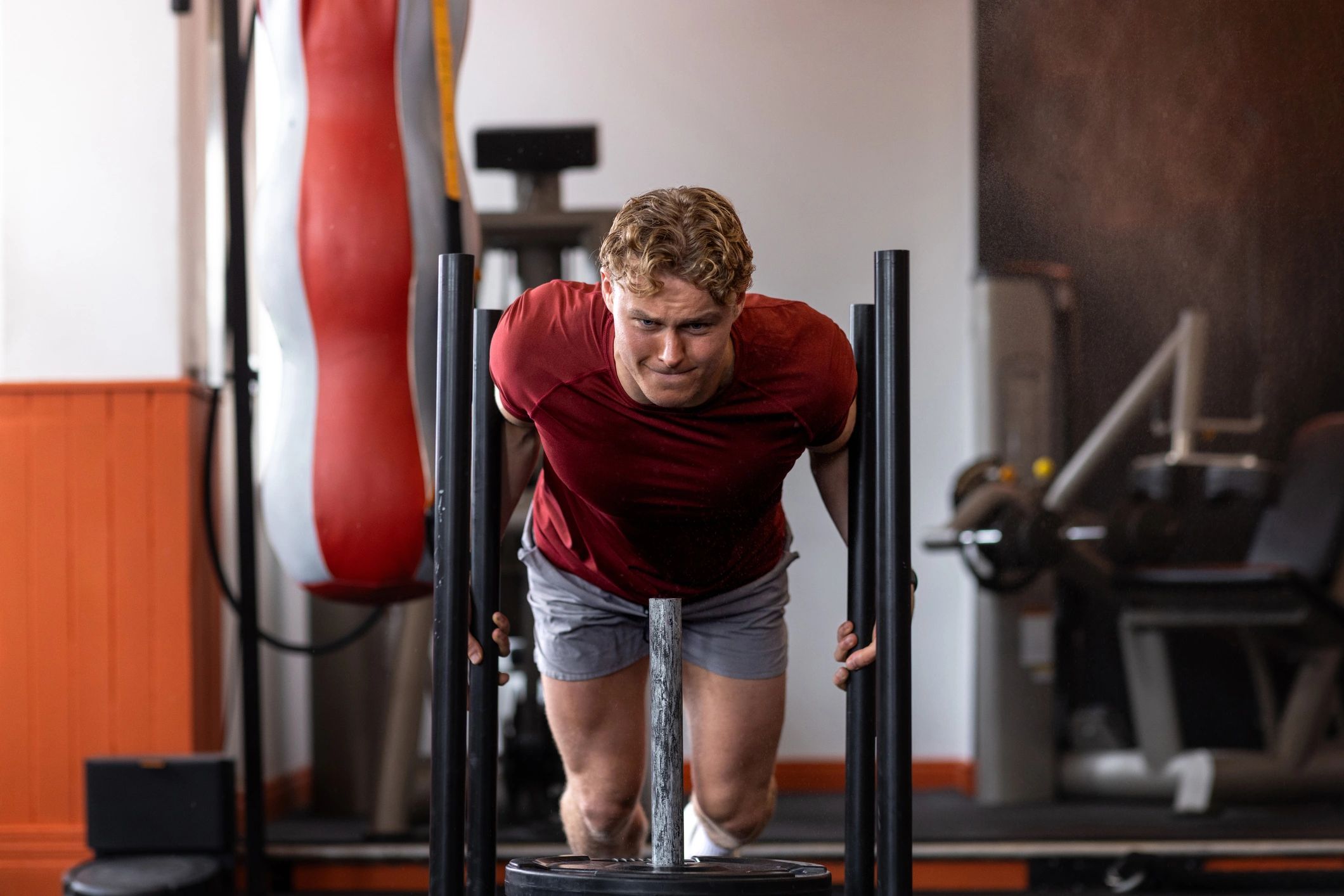 Athlete training intensely in a modern gym